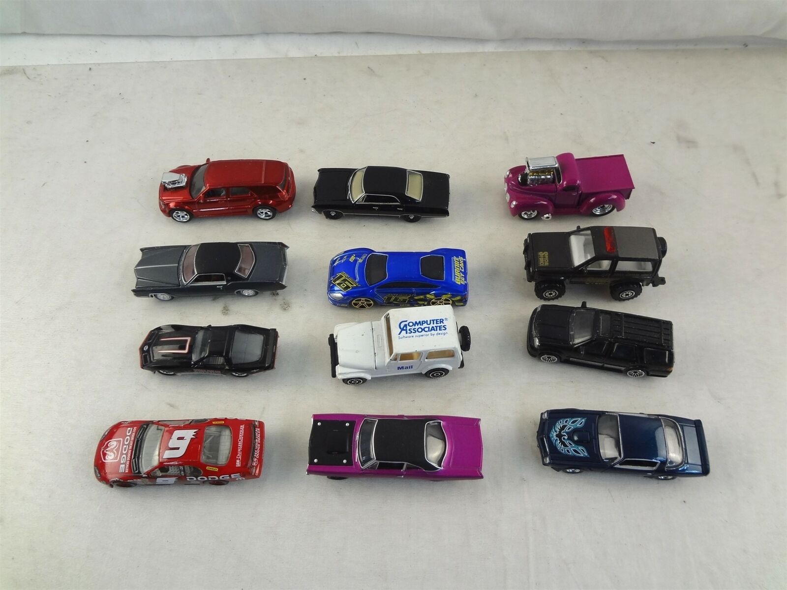 12x Assorted Die Cast Toy Cars Trucks Jeeps Impala Plymouth Navigator Firebird